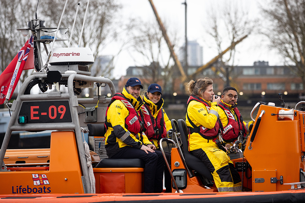 RNLI crew and Prince and Princess of Wales aboard E-class lifeboat E-09 at Tower RNLI on the River Thames.