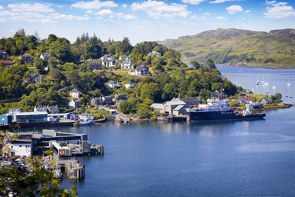 Oban harbour on Scotland’s west coast with hillside homes, marina and ferries, host port for the RIB Rendezvous fleet.