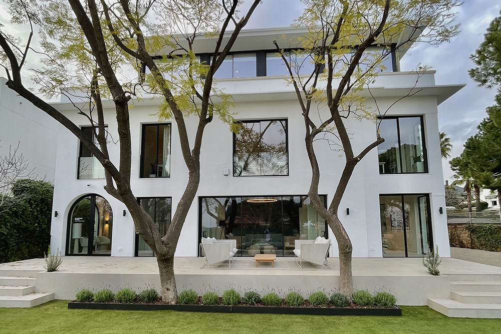 De Antonio Yachts Casa Barcelona headquarters in Pedralbes, a restored 1936 tower house set within landscaped grounds in Barcelona.