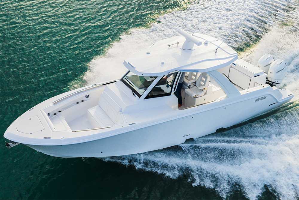 Aerial view of the Intrepid 35 Panacea centre console powerboat running at speed with twin Mercury V10 outboards and hardtop helm.