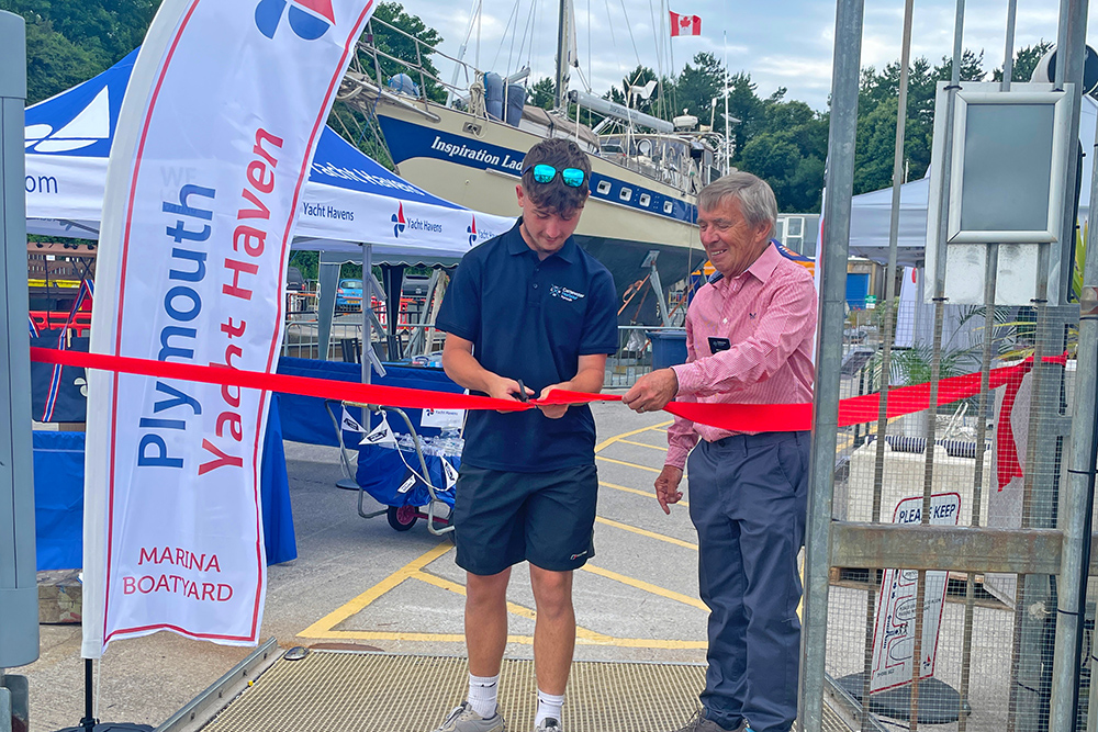 Ribbon cutting ceremony at Plymouth Boat Fest entrance, marking opening at Plymouth Yacht Haven marina