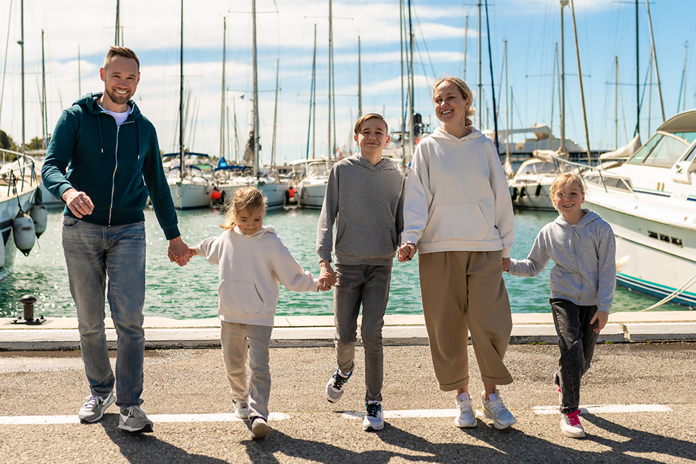 Family happily walking in marina