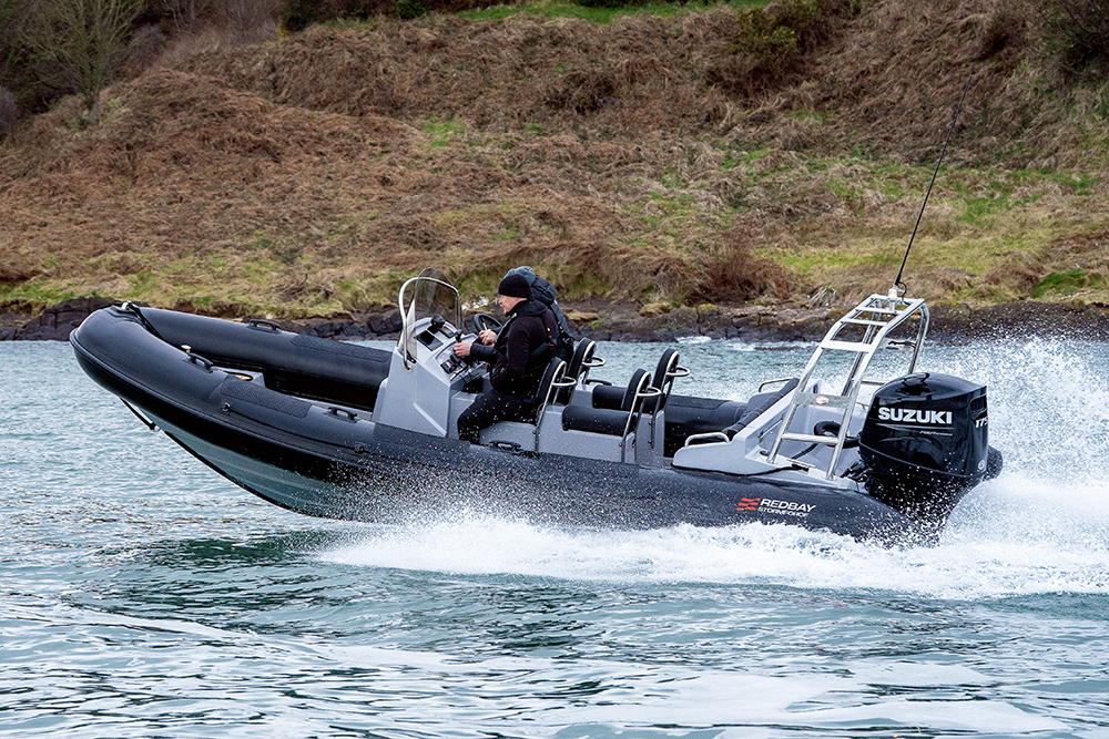 Redbay Stormforce 650 RIB cruising at speed with Suzuki outboard, helm console and jockey seats in coastal waters