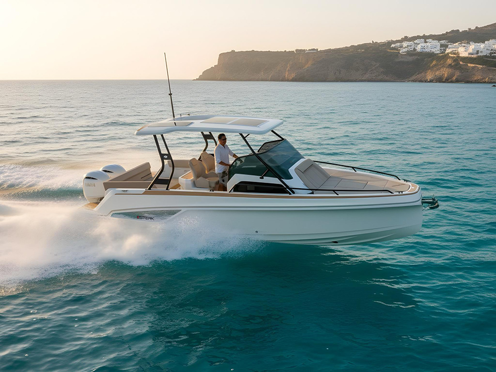 Sterk 26 underway on turquoise sea and cliffs behind in the background with man in white shirt standing at the helm