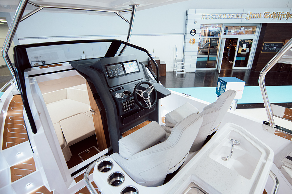 Helm station to the Sterk 26 showing open door intio the fore cabin.