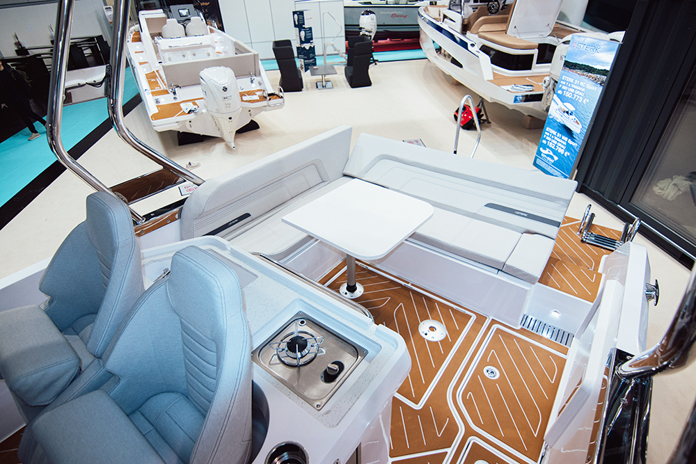 Aft social area of the Sterk 26 showing bench seating and galley in the foreground