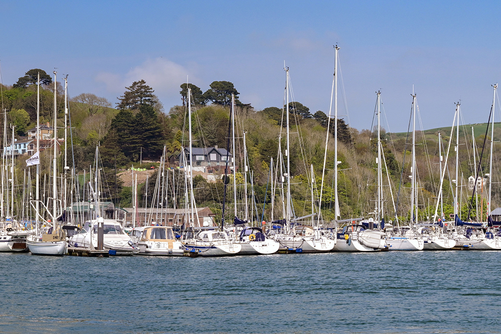 Dartmouth marina with sailboats moored on the River Dart.
