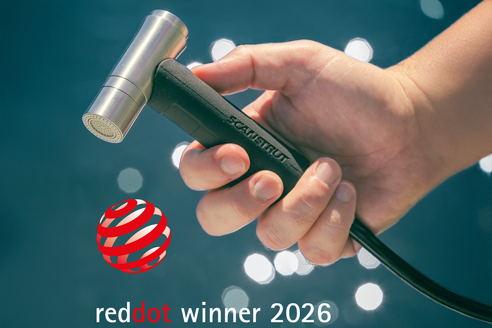 Hand holding Scanstrut Ventura outlet with hose connection.