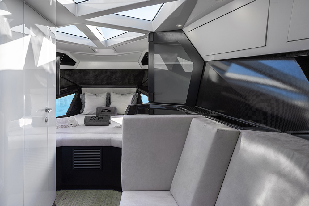 Double cabin in the bow with triangular roof windows letting in the sunlight