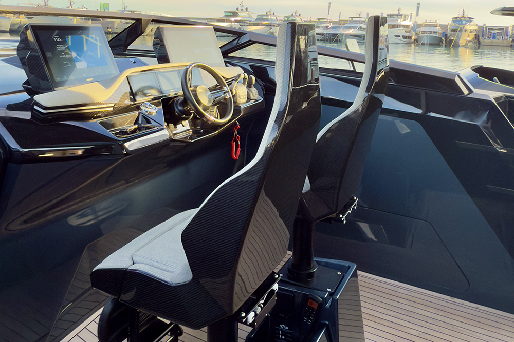 Two shock mitigation helm seats upholstered in grey