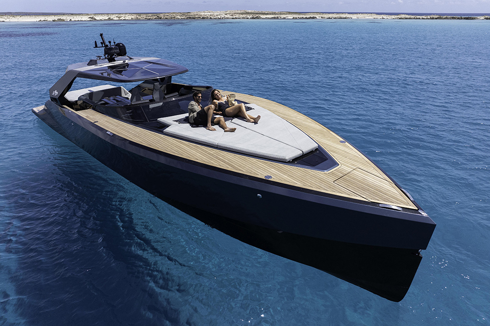 The Say 52 at rest with a couple relaxing on the foredeck sunbed