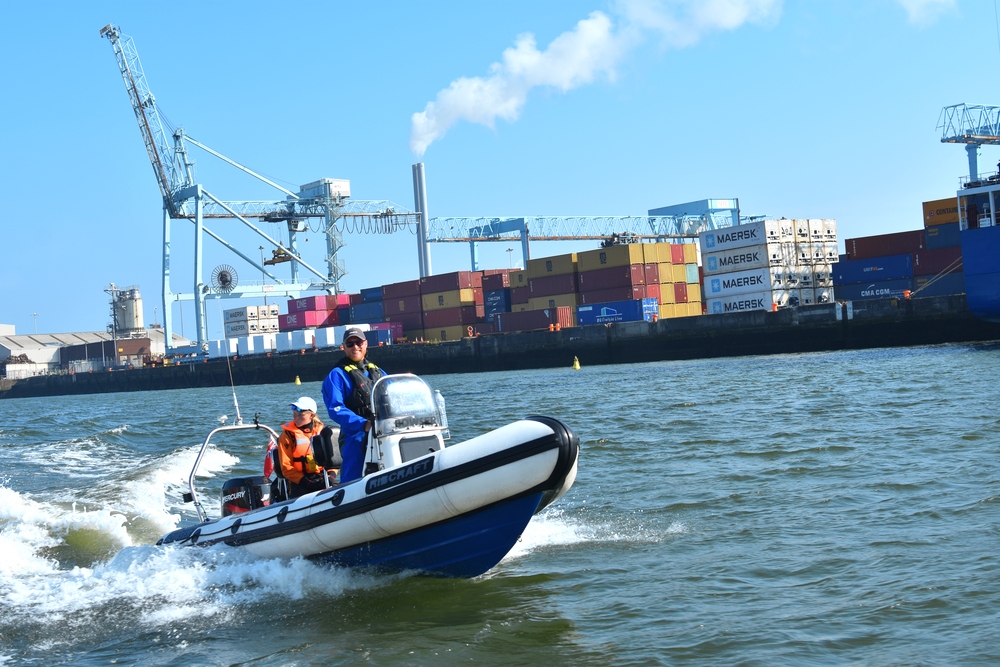 Ribcraft RIB passing container docks on Dublin’s River Liffey during the Holyhead crossing trip