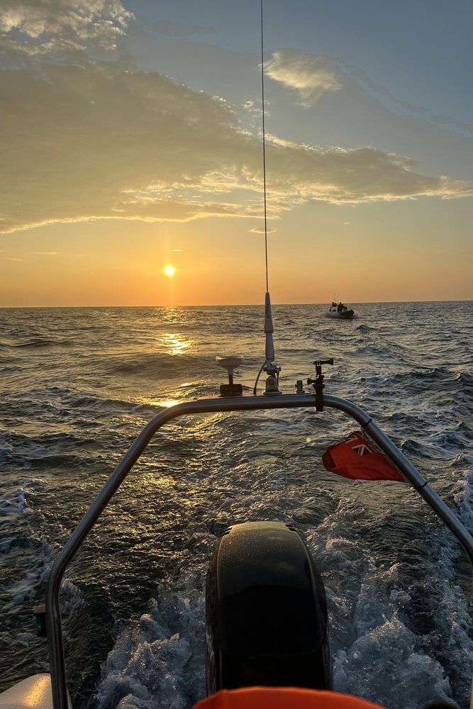 RIB returning from Dublin towards Anglesey at sunset after an Irish Sea crossing