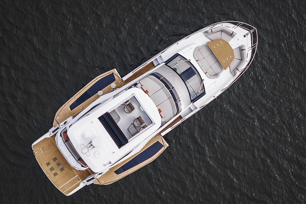 Aerial view of the Galeon 520 FLY showing the flybridge layout, foredeck seating and fold-out side balconies