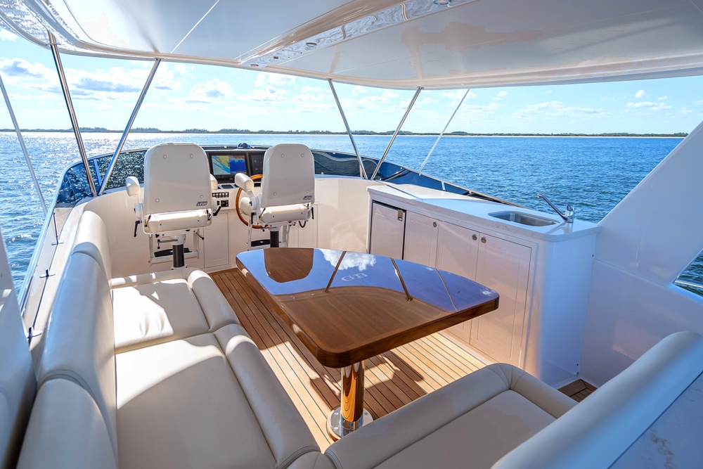 Looking across sofas and dining table to the flybridge driving position