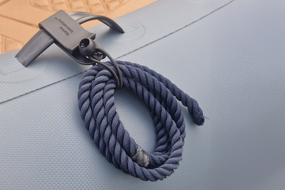 RIB Fender Mate fitted to flat handle RIB tube with coiled rope, showing practical fender and rope management system.