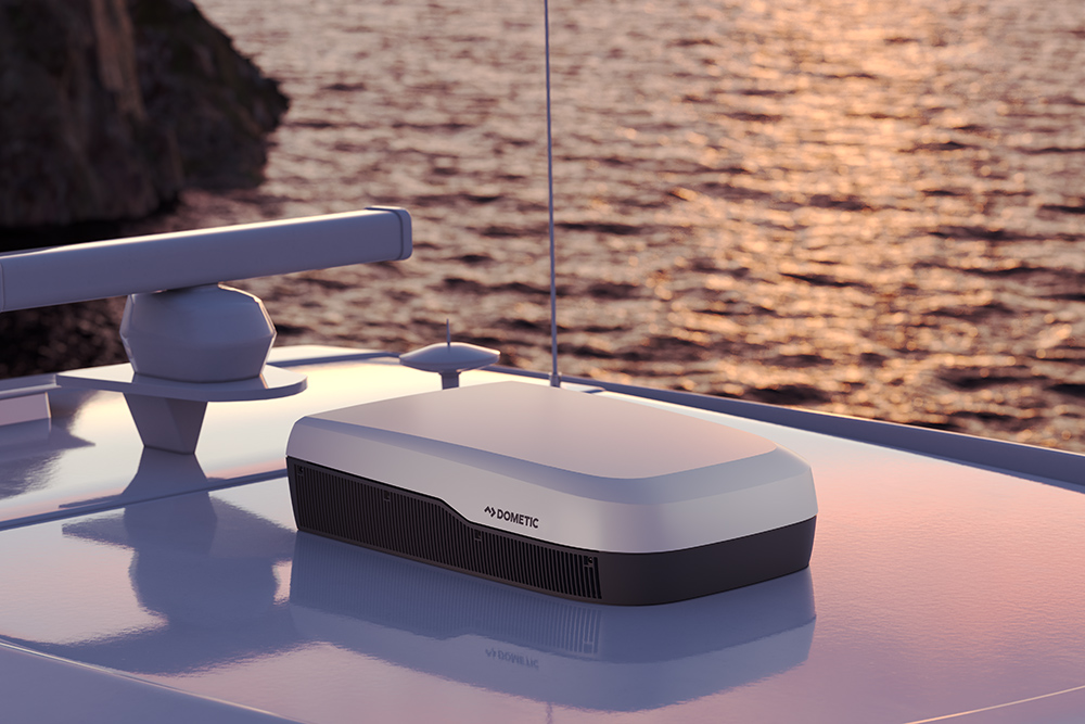 Dometic FreshJet rooftop marine air conditioning unit on a boat cabin roof at sunset