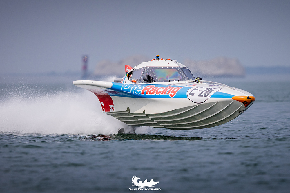 Life Racing offshore powerboat at speed during a UKOPRA race on open water.