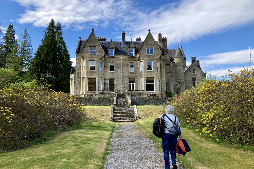 Guest arriving at Glengarry Castle Hotel