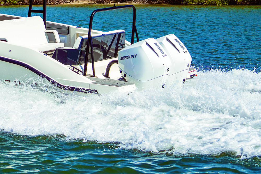 Twin Mercury outboards to Navan T30 pushing through the sea with bubbling wake