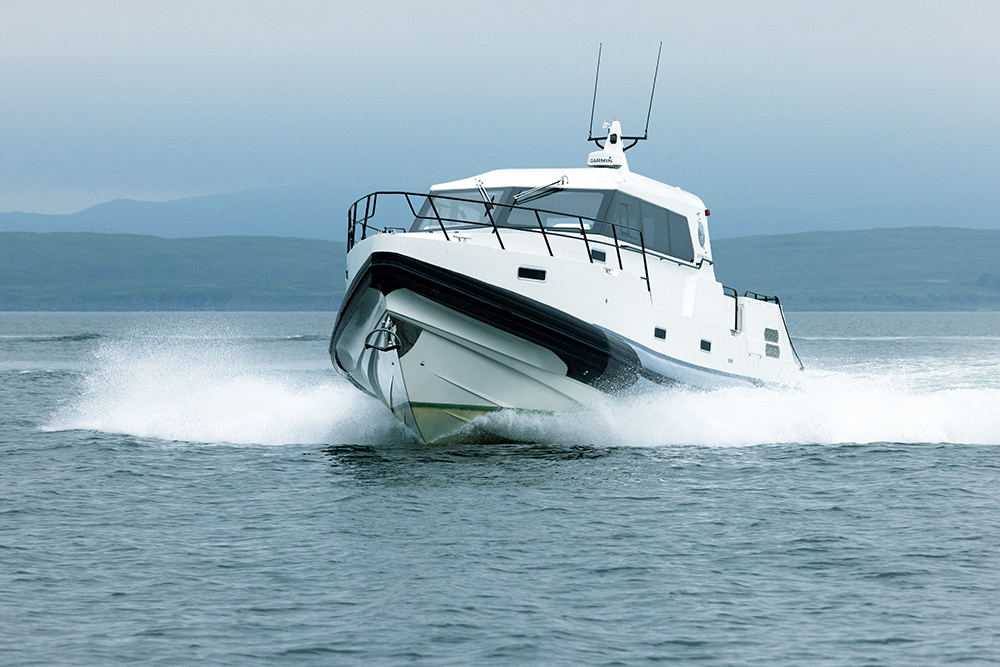 Big Redbay cabin RIB underway at sea with white spray