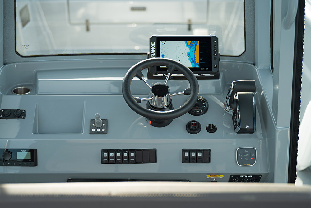 Dash on helm of Sting 725 Pro showing Lowrance fishfinder & GPS