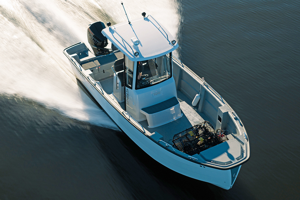 Sting 725 Pro T-Top underway at sea showing ample deck space and protective T-top
