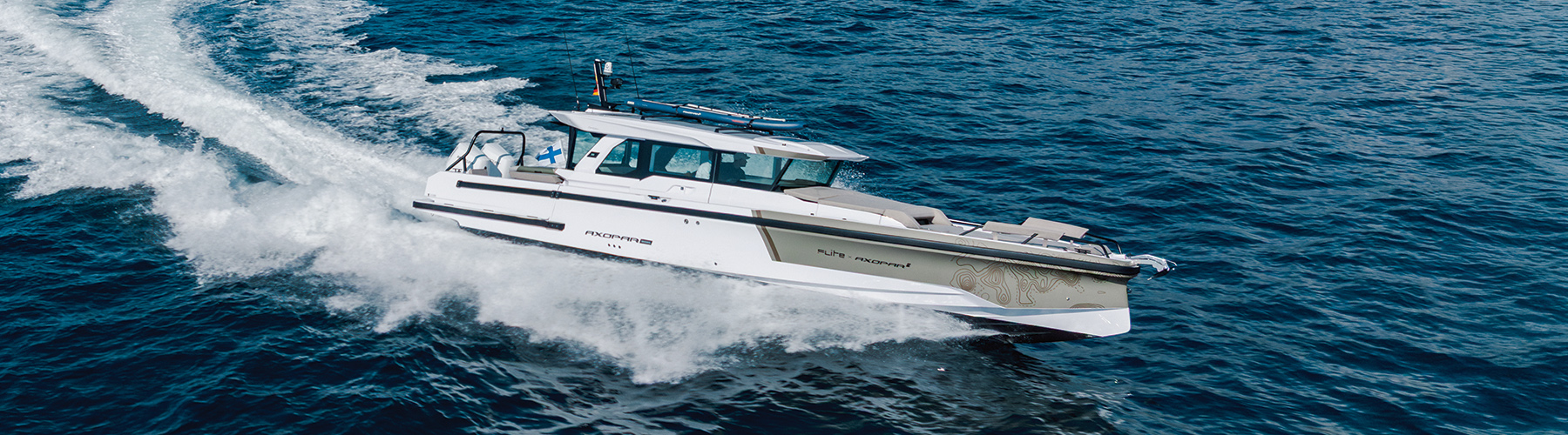 Axopar 38 XC making way at speed on a turquoise sea