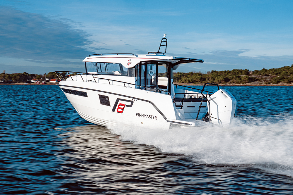 Finnmaster Pilothouse 8 underway with trees on the shoreline behind