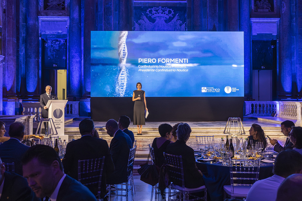 Piero Formenti speaks at the Design Innovation Awards ceremony as marine industry guests dine in Genoa
