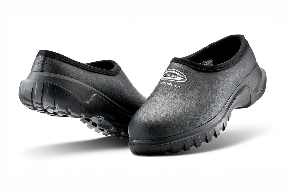 Black Grubs Waterline waterproof slip-on shoes with rugged soles for waterside and outdoor use.
