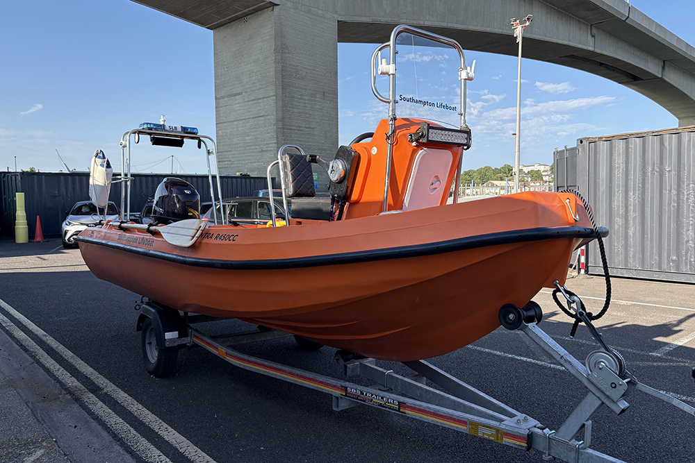 Orange Kontra R450CC rescue boat, Southampton Lifeboat, on its launch trailer beneath Itchen Bridge, Southampton.