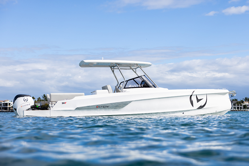 STERK 26E electric dayboat underway, showing its white hull, T-top and electric outboard.