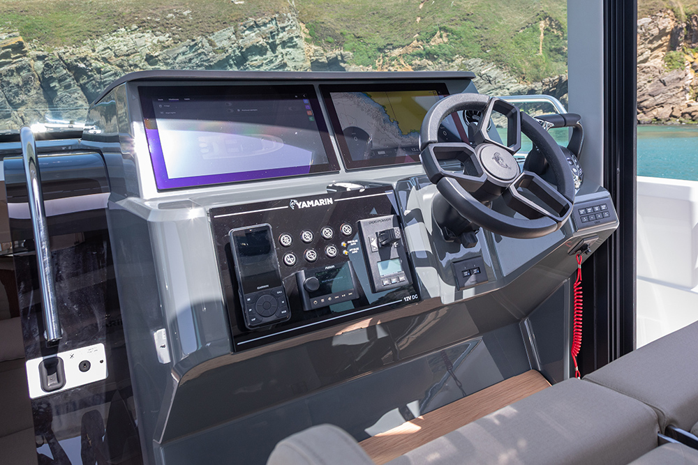 Helm station with electronics and steering wheel