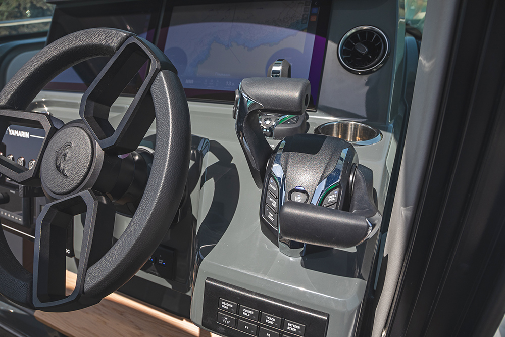 Close up view of steering wheel and Yamaha Helm Master throttle controls.