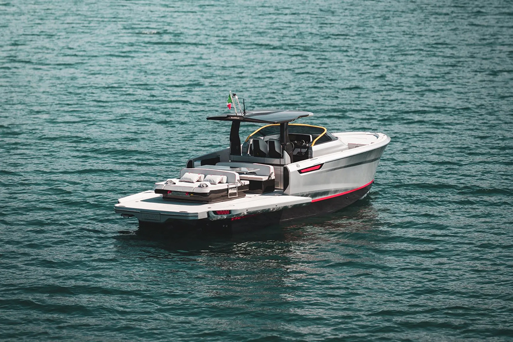 Bellini Astor 38 motor yacht at anchor, showing its open aft deck, sunbed and bathing platform