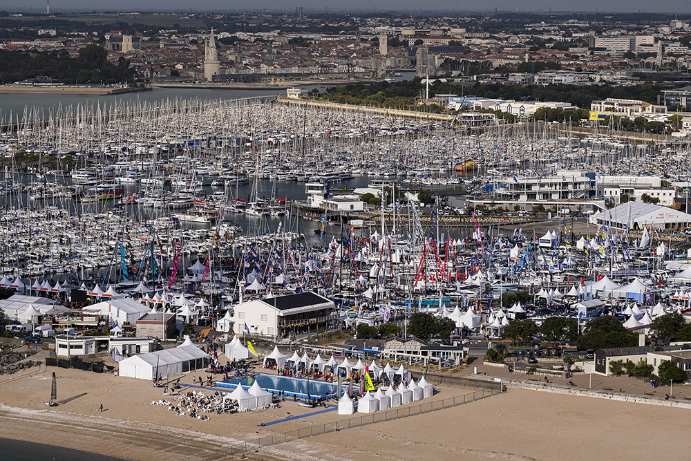 Aerial view of Grand Pavois La Rochelle boat show, with marina packed with yachts and sailboats beside La Rochelle's old town