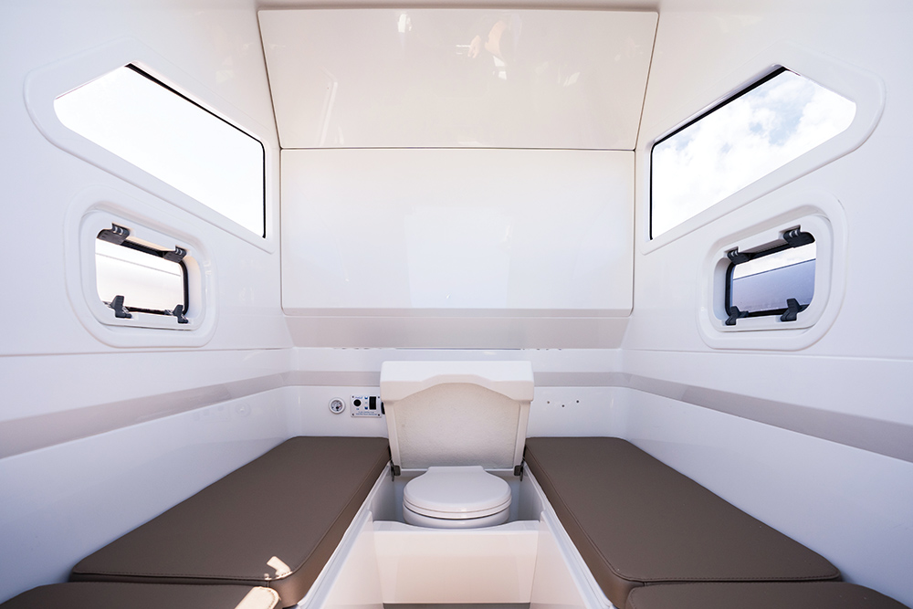 Cabin with twin beds and toilet in the middle
