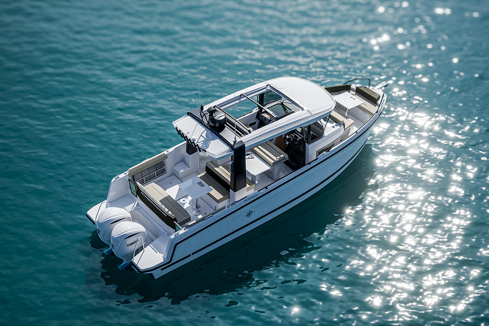 Jeanneau EX 34 from above, showing the walkaround deck, glazed helm enclosure, aft cockpit seating and twin Yamaha outboards.