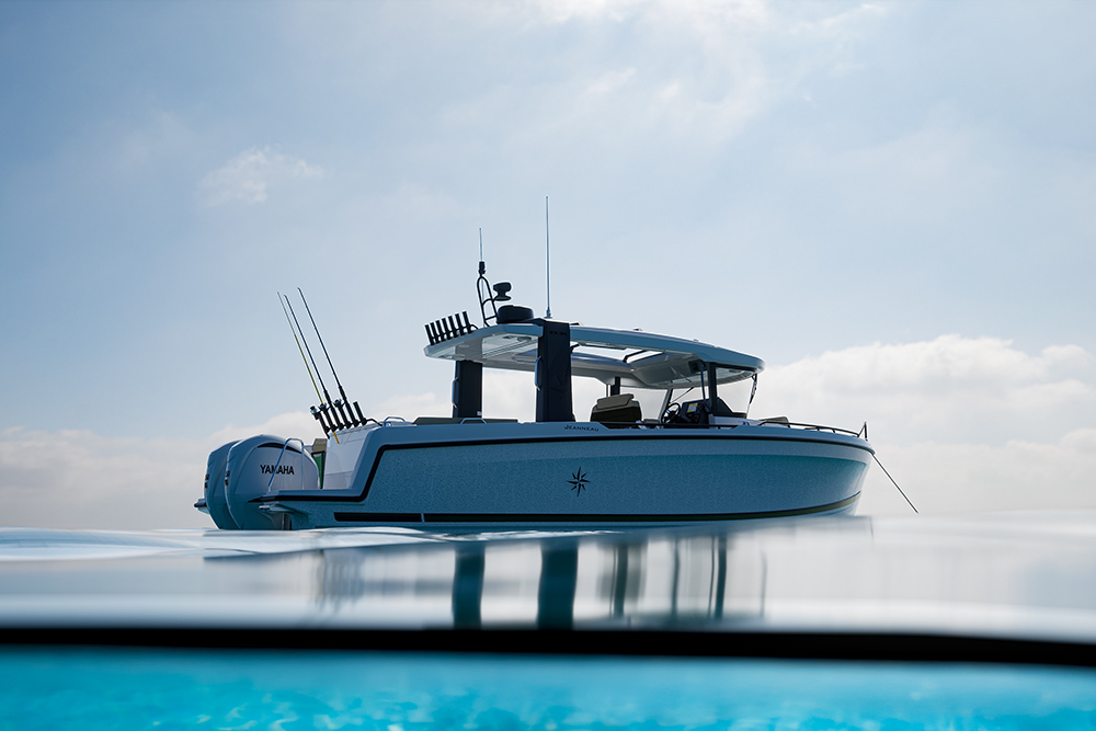 Jeanneau EX 34 Hardtop with twin Yamaha outboards, half-underwater view showing the open aft cockpit and T-top.