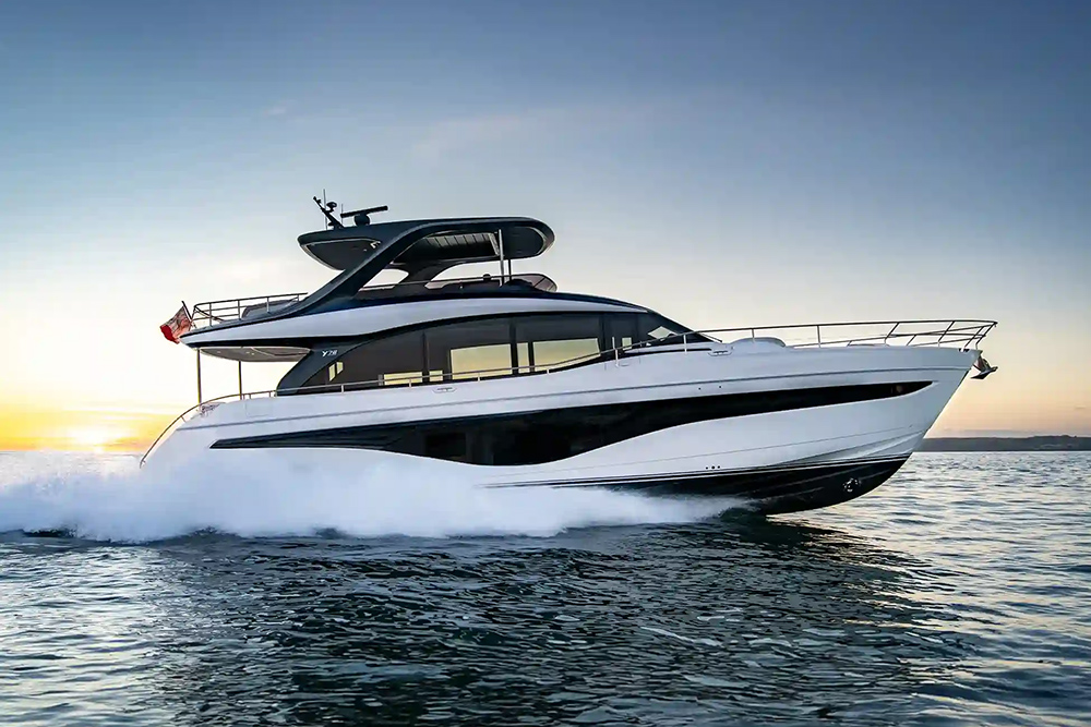 Princess Y78 flybridge motor yacht underway at sunset, throwing spray as it cuts across calm open water.