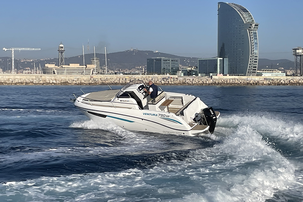 Rodman 790 Ventura SD powerboat with outboard engine underway near Barcelona’s waterfront