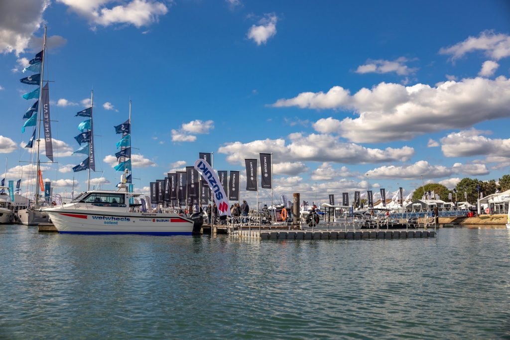 Wetwheels Solent accessible boat, powered by Suzuki, moored in the marina at Southampton International Boat Show.