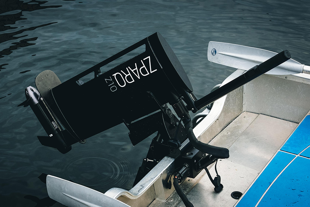 Zparq Z10 electric outboard motor mounted on a boat's transom, showing its compact tilt-and-trim mounting bracket.