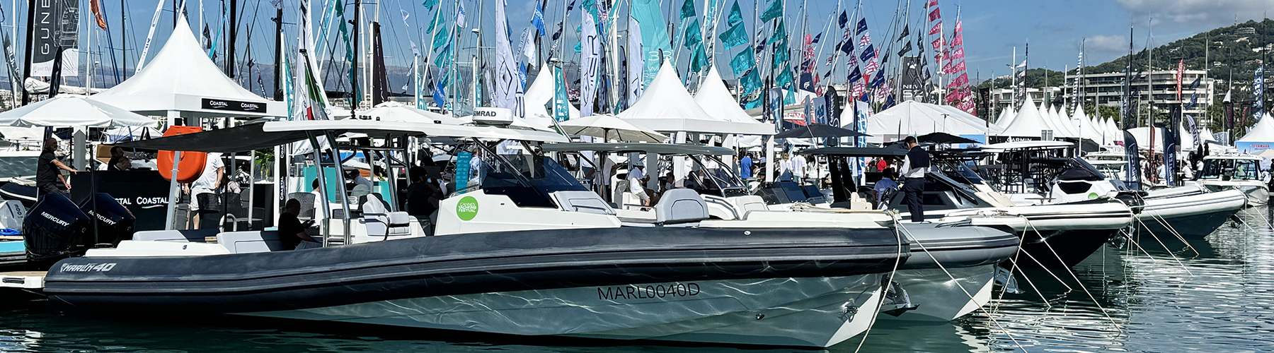 Boats moored up in a row on pontoons at Cannes Yachting Festival