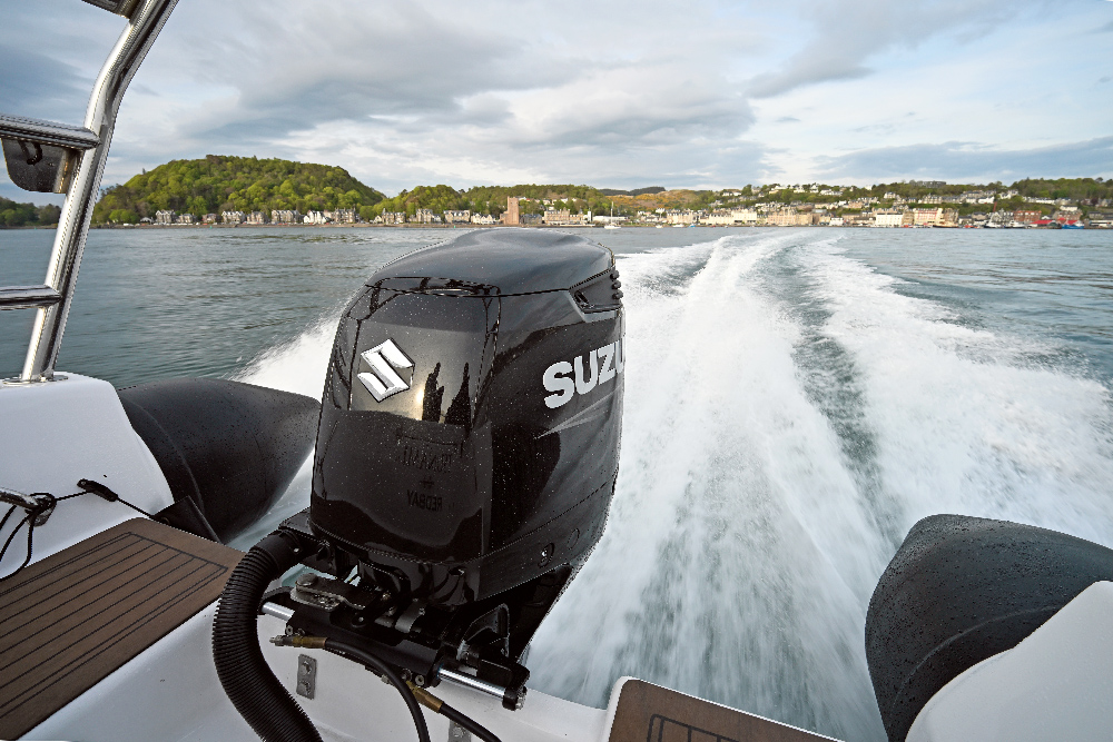 Suzuki outboard on the transom of the Redbay SF750 at speed off Oban