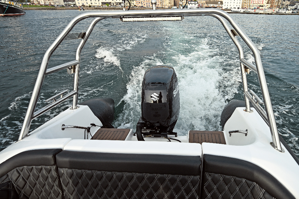 View aft from the Redbay SF750 cockpit over the single Suzuki outboard and its wake